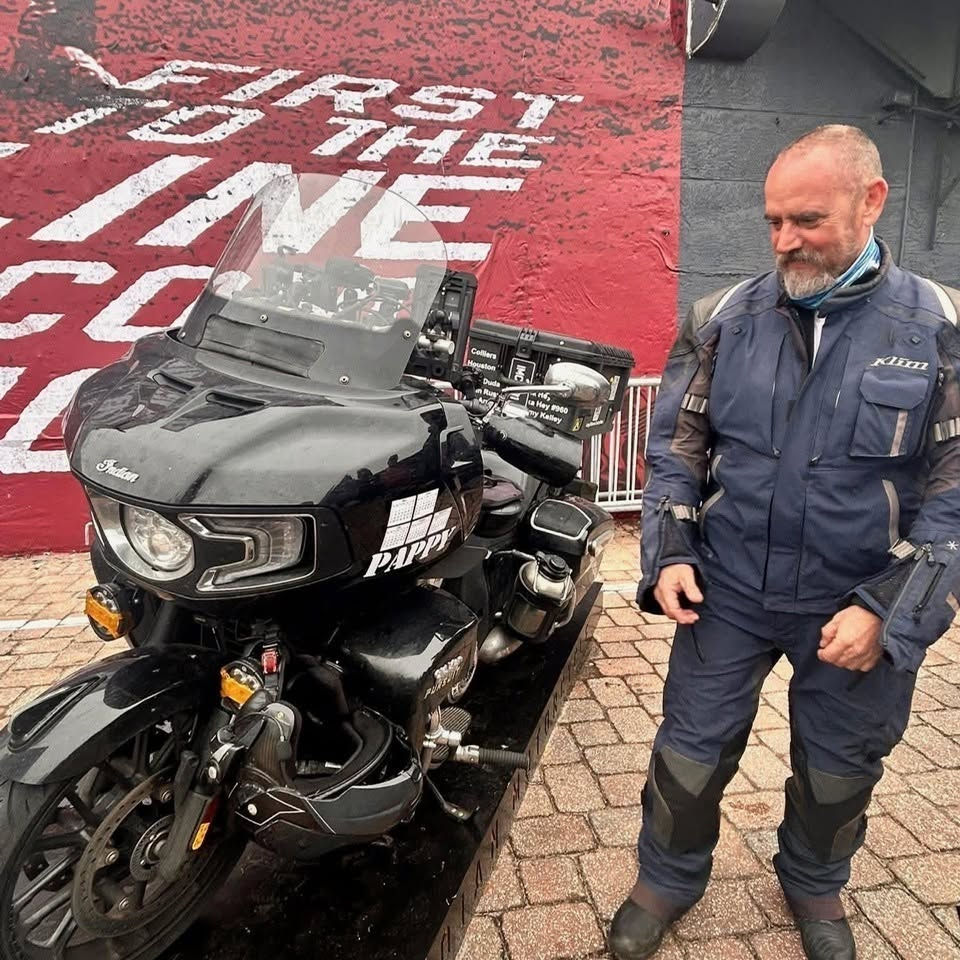 Patrick Cornell standing beside Pappy, his Indian Pursuit motorcycle, during the 201,901-mile endura