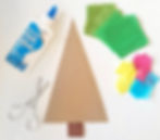 cardboard in christmas tree shape, pot of pva glue, scissors and some colourful tissue paper