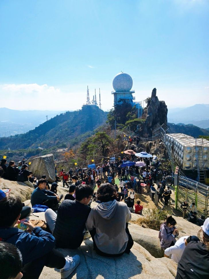 Mt Gwanak (with Seoul in the valley.) It can take up to an hour to get a photo at the top due to the crowds.