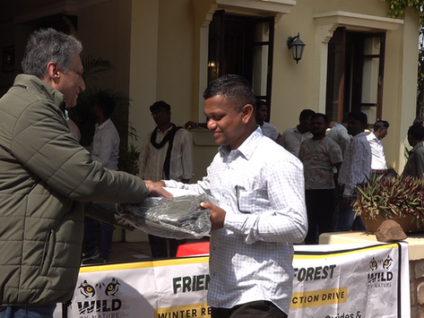 Recipient receiving the jacket at Tadoba