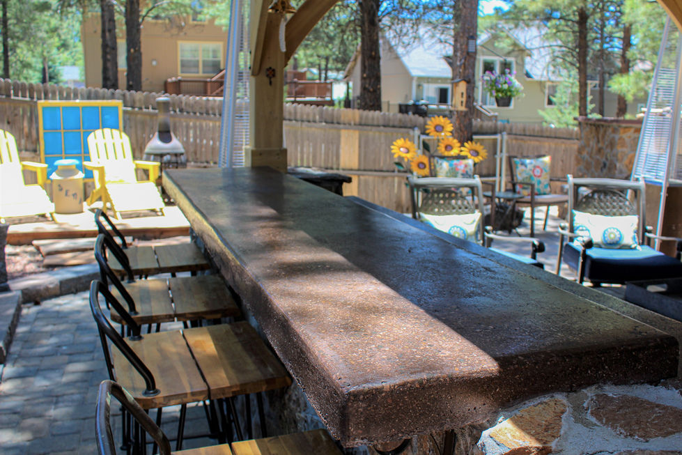 Close-up of poured concrete countertop craftsmanship in outdoor kitchen