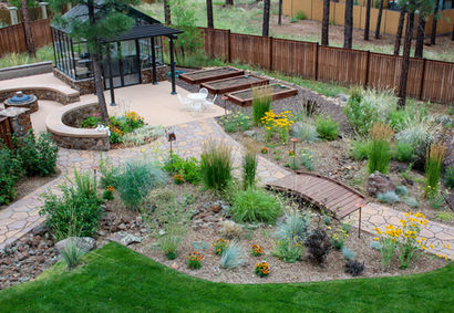 Elevated view of backyard showing paths, lawn, and garden beds