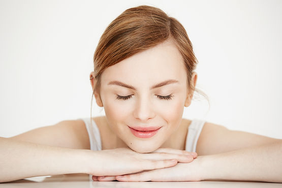 young-beautiful-girl-with-perfect-clean-skin-smiling-with-closed-eyes-sitting-table-beauty