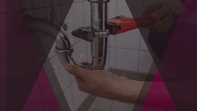 Close-up of hands using wrench to fix a leaking chrome pipe under a sink — emergency plumbing repair in Essex. Emergency plumbing repair in Maldon, Essex — fixing leaking kitchen and bathroom pipes quickly and efficiently.