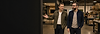 Carlos touring a client’s warehouse while the business owner explains the company’s operations
