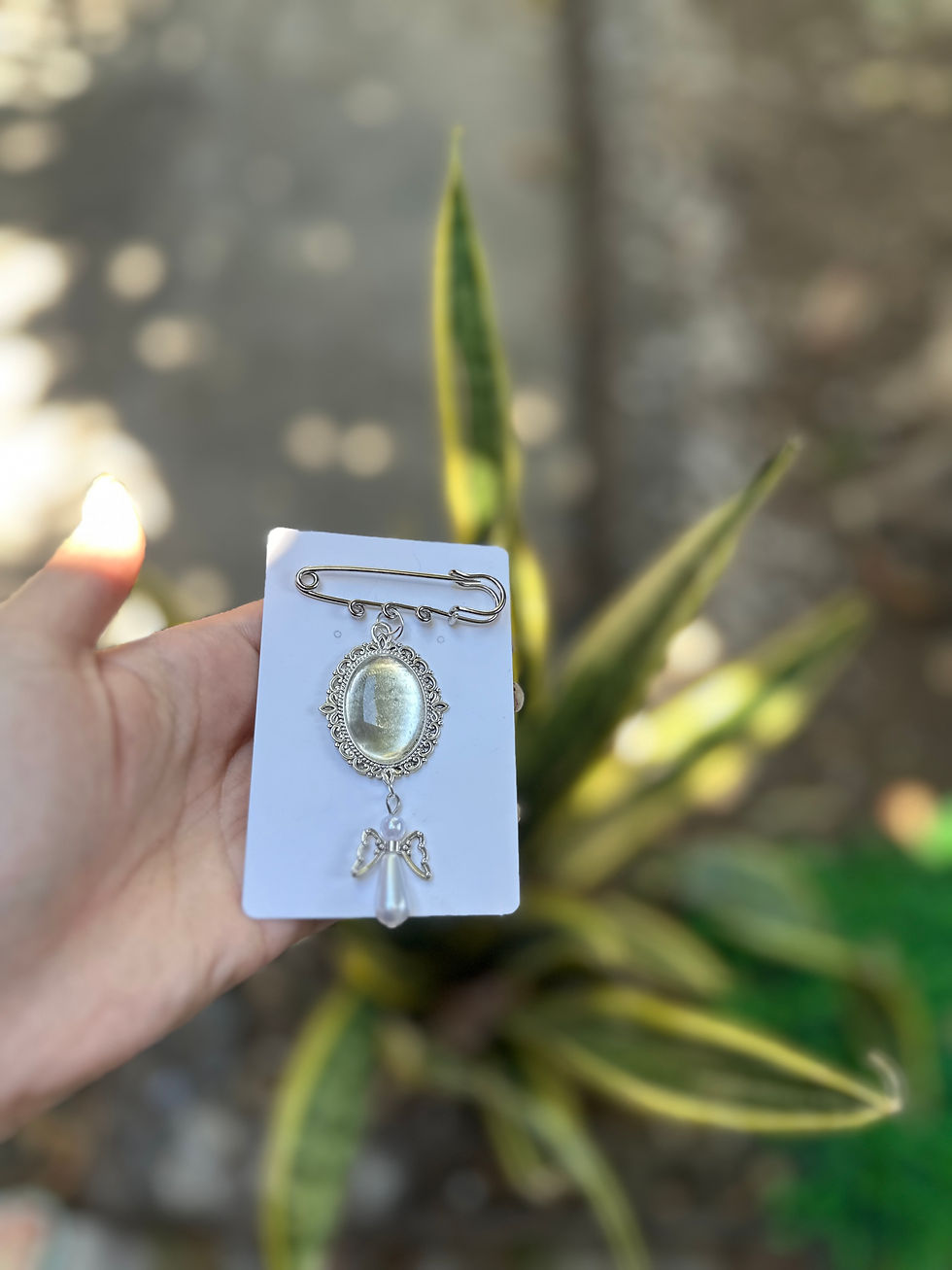 Miniatura: Relicario con dije de ángel 