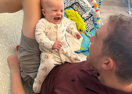 baby and dad singing together