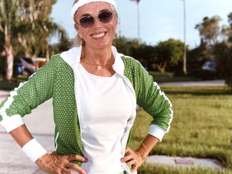 Retired woman playing outdoors with grandchildren after knee pain treatment at Prestige Regenerative Medicine