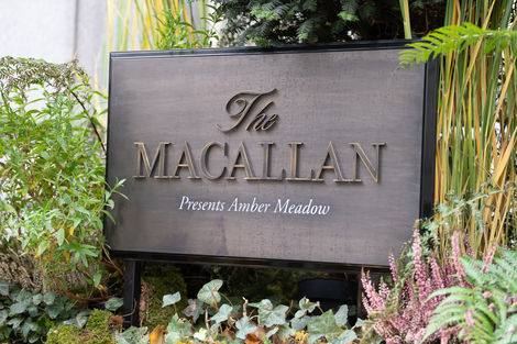 a sign that says the macallan presents amber meadow