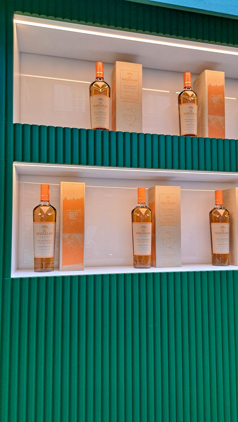 several bottles of macallan whiskey are on display