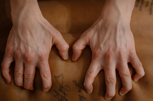 myofacial release massage using hands and fingers pressing on trigger points in the shoulder area
