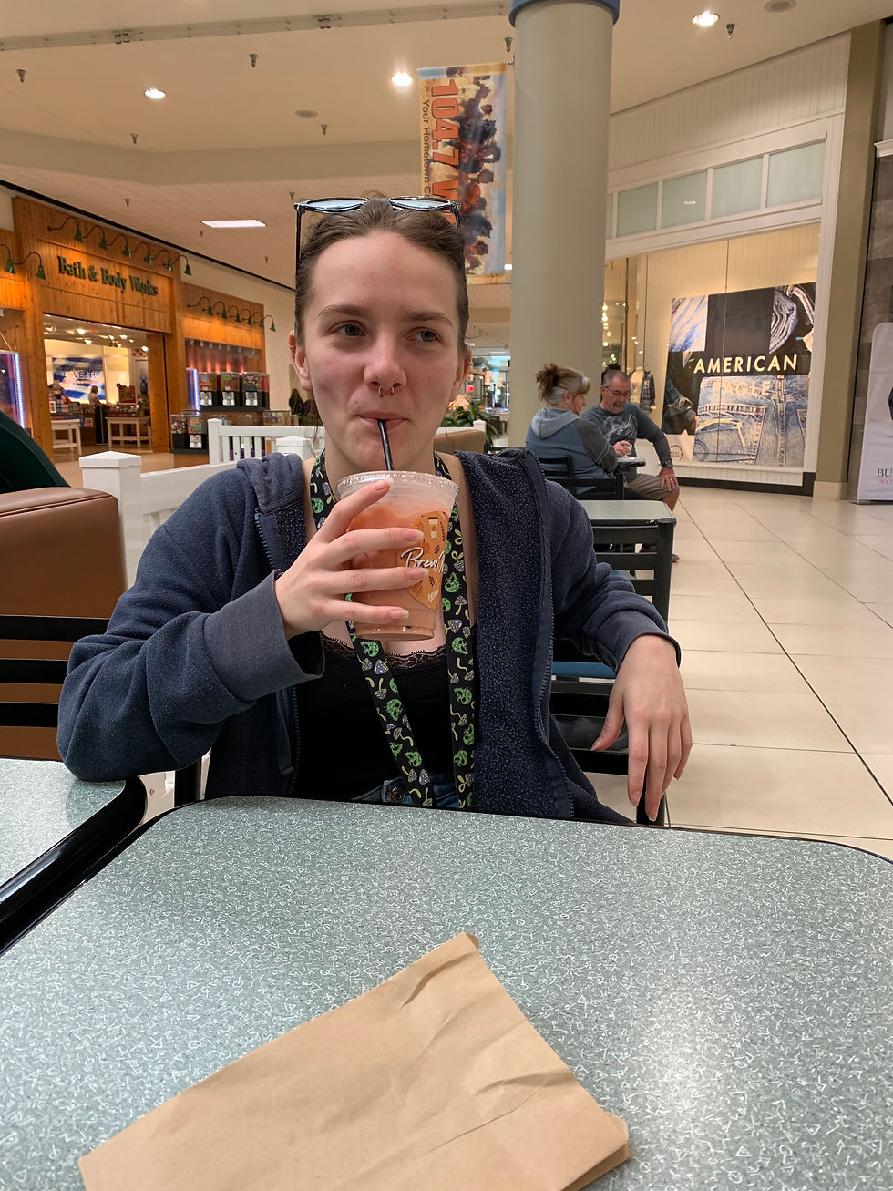 Grace drinking her strawberry latte.