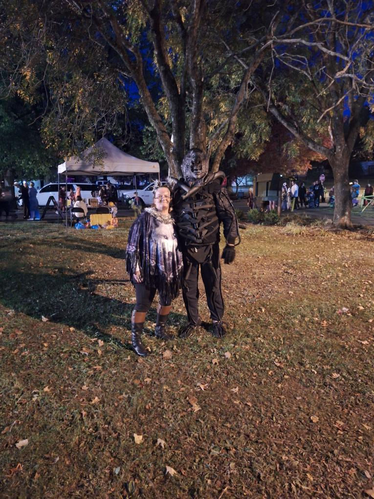 A Xenomorph alien costume, highly decorated.