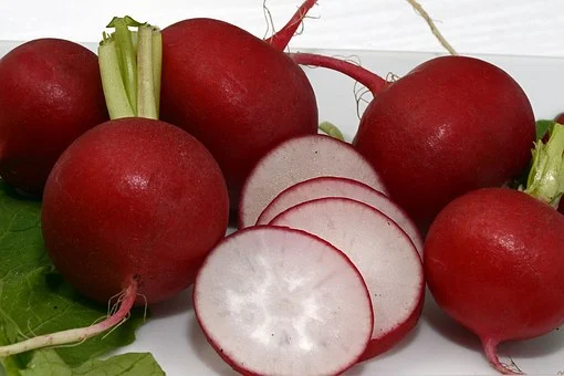Sliced Radish With Whole Raw Radishes