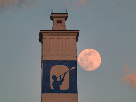 Moon next to Little Joe Tower in Corning, NY