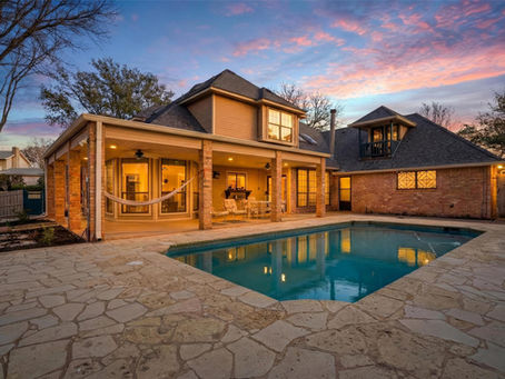 Back porch view of home with pool