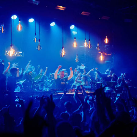 Chris Stussy performing at Index Dublin with a cheering crowd.