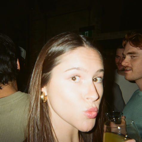 Woman making a kiss face at a Breakfast Club Toronto event