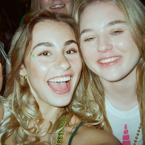 Smiling young women celebrating St. Patrick's Day in Toronto