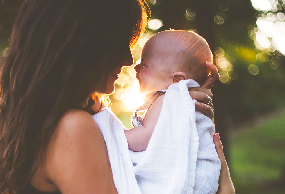 Mother face to face with newborn, almost touching noses