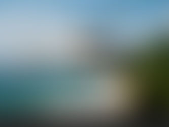 White helicopter flying over tropical beach with lush green hills and blue ocean. Text reads "Best Places in Thailand for Private Flying."