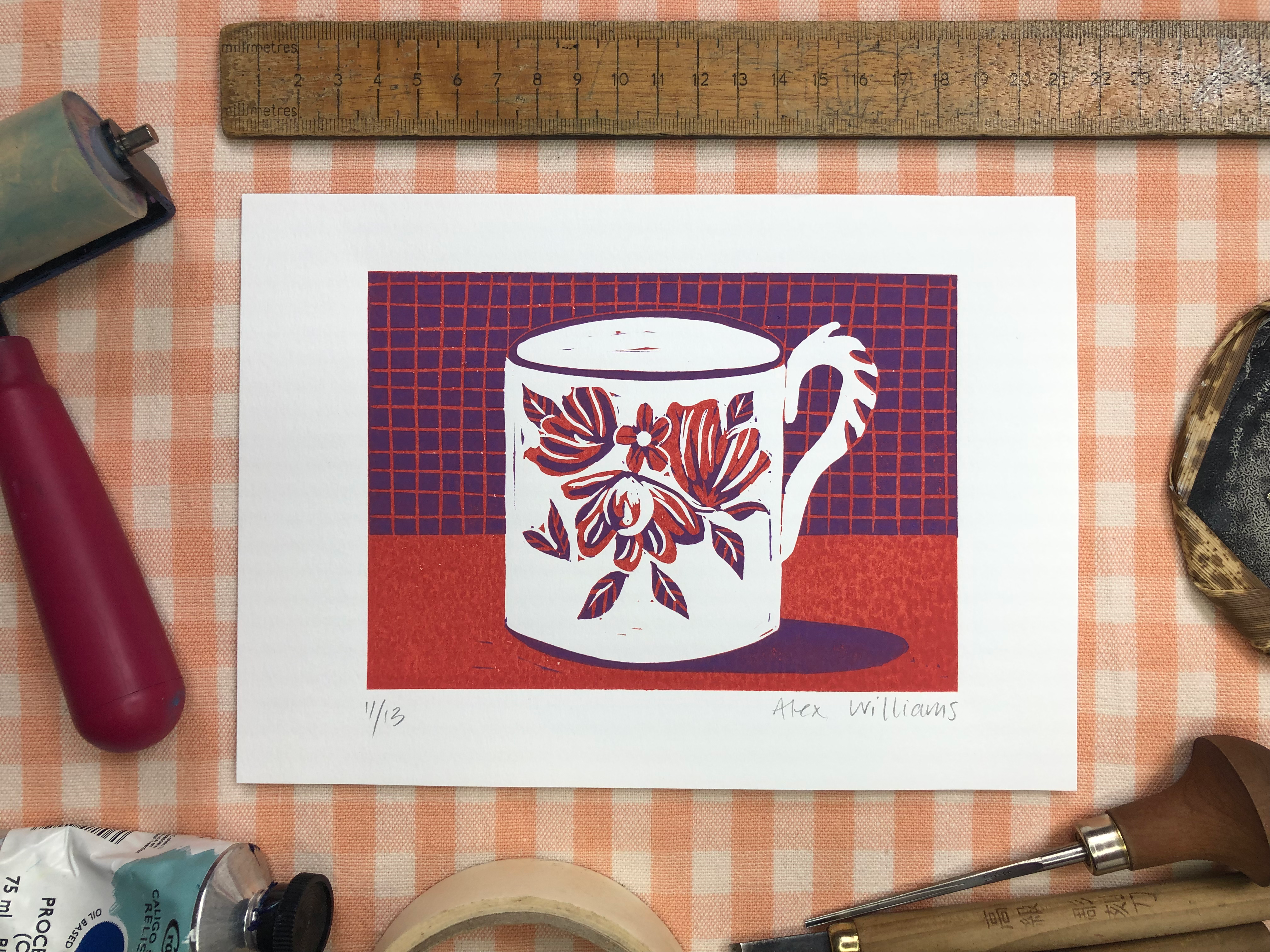 Original reduction linocut print of a flowery cup in purple and red