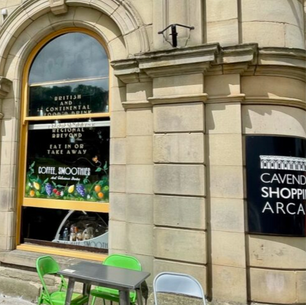 Exterior of Cavendish Shopping Arcade in Buxton town centre, a short walk from group accommodation and cafés.