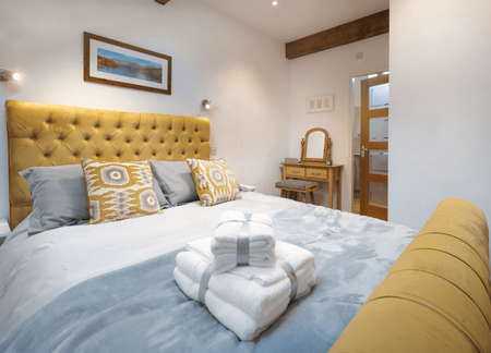 Boutique double bedroom with soft furnishings in Lake District holiday cottage near Kendal