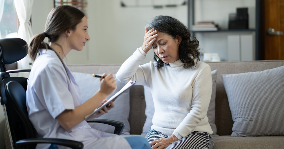Healthcare professional consulting with a female patient in distress