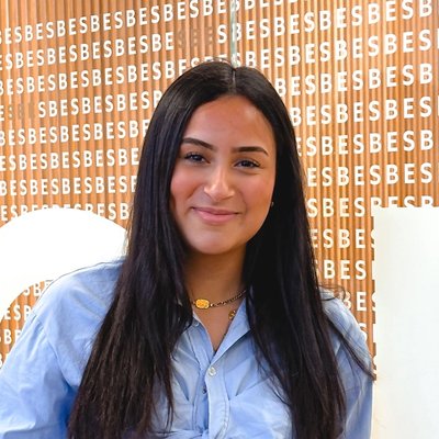 Portrait of Ayat Azzimani smiling, wearing a light blue shirt
