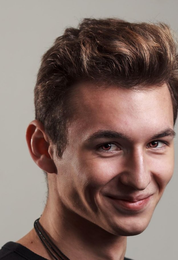 Close-up portrait of Alexandru Mariș smiling