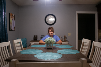 Mom at dinner table.png