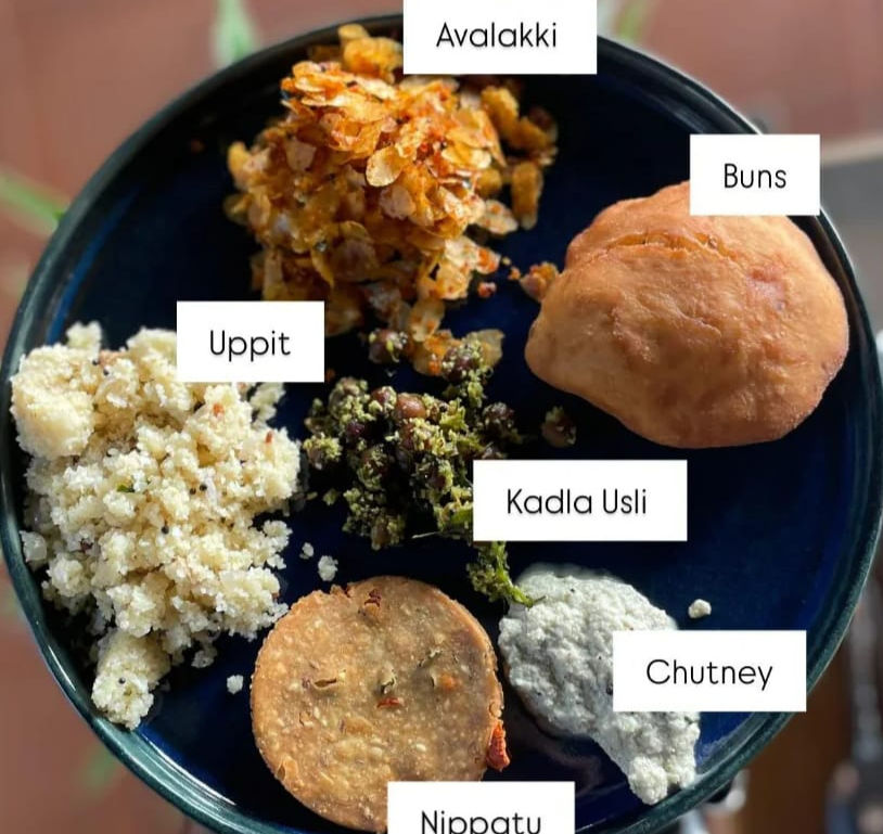 High angle view of a traditional breakfast spread with local dishes and fresh fruits