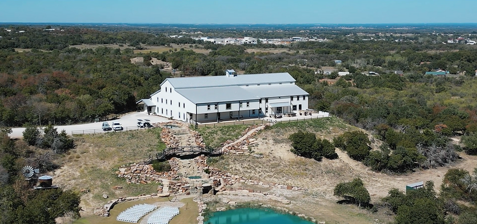 wedding videographer in Dallas, Texas captures aerial coverage of Covered Bridge Venue in Springtown, Texas.
