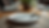 Eye-level view of a modern dining table set with premium cutlery and plates