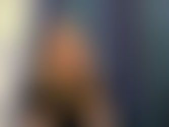 Event interview cover image showing a woman wearing glasses and a microphone, seated against a technical industrial display background