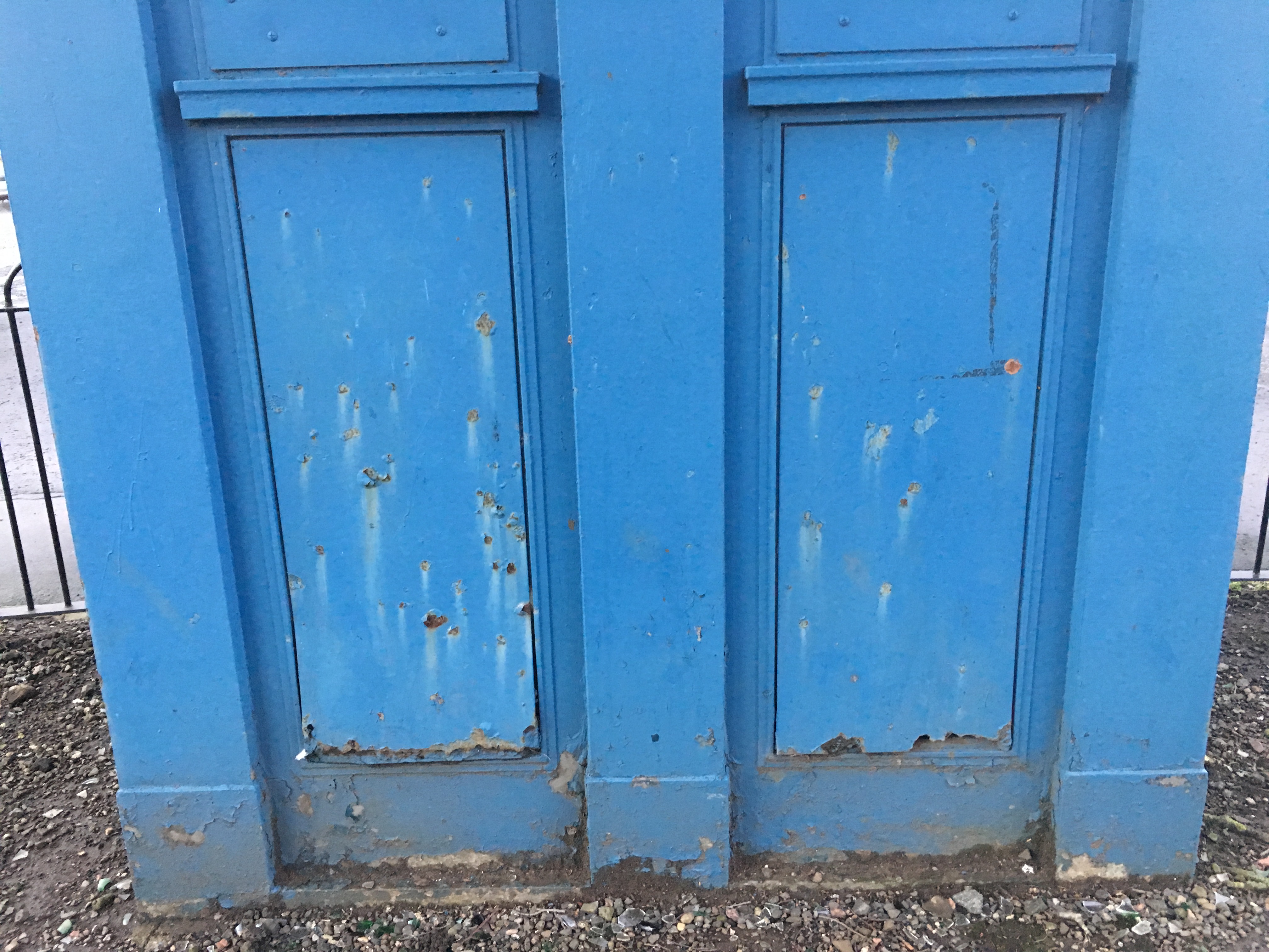 Rear, exterior, showing rusted panel