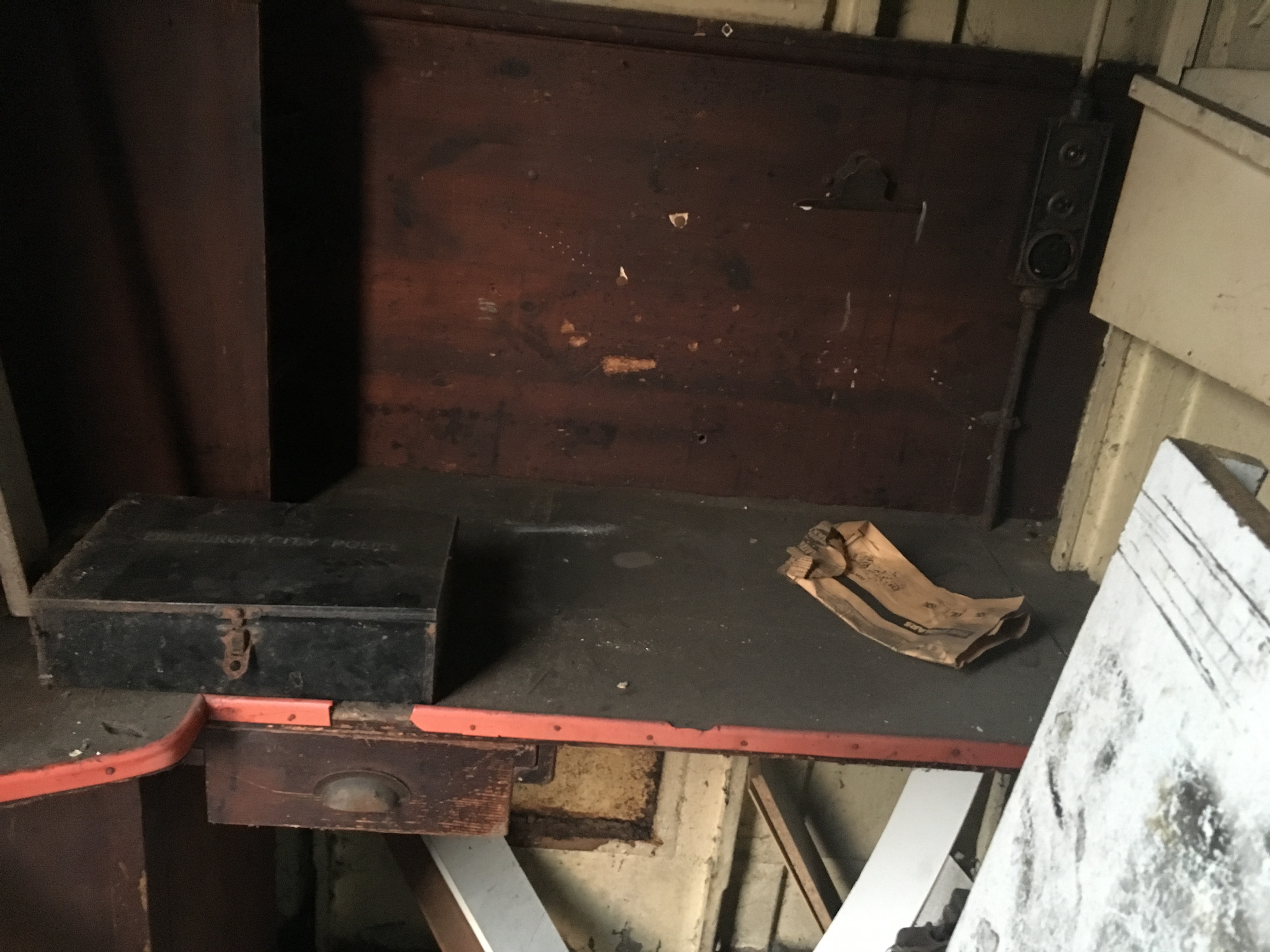 Black tin on desk