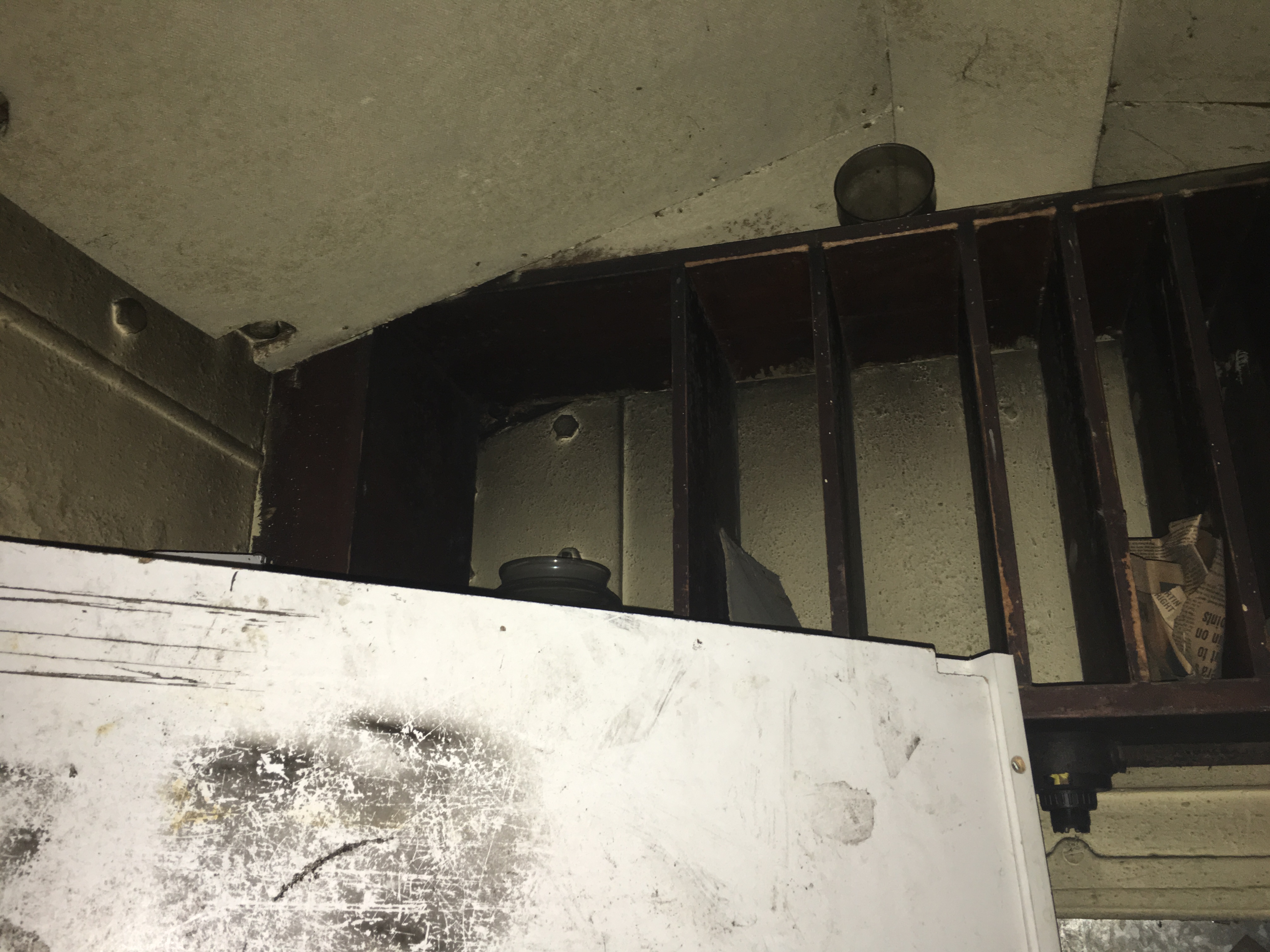 Shelf at ceiling, above desk