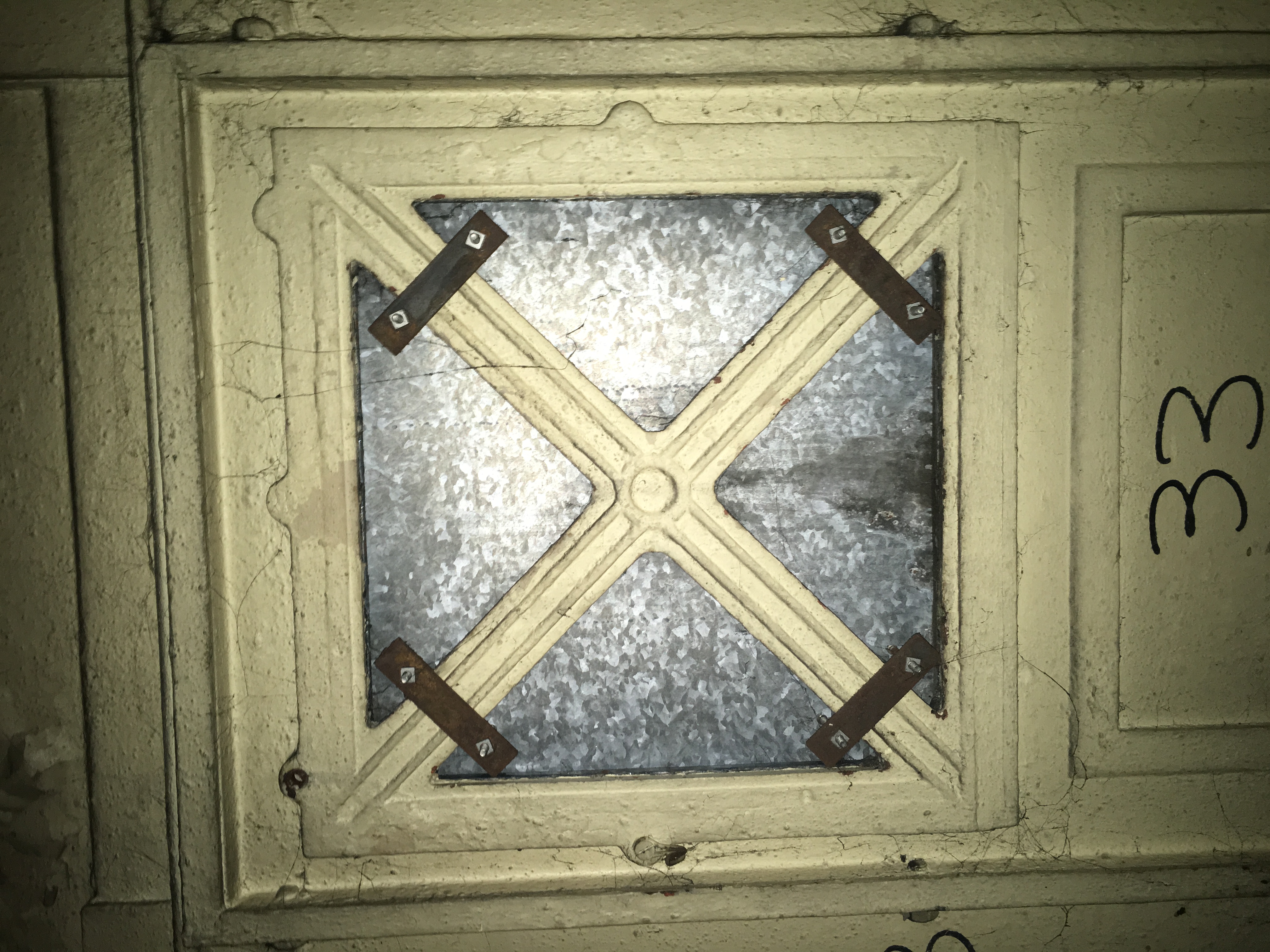Window with steel plate covering