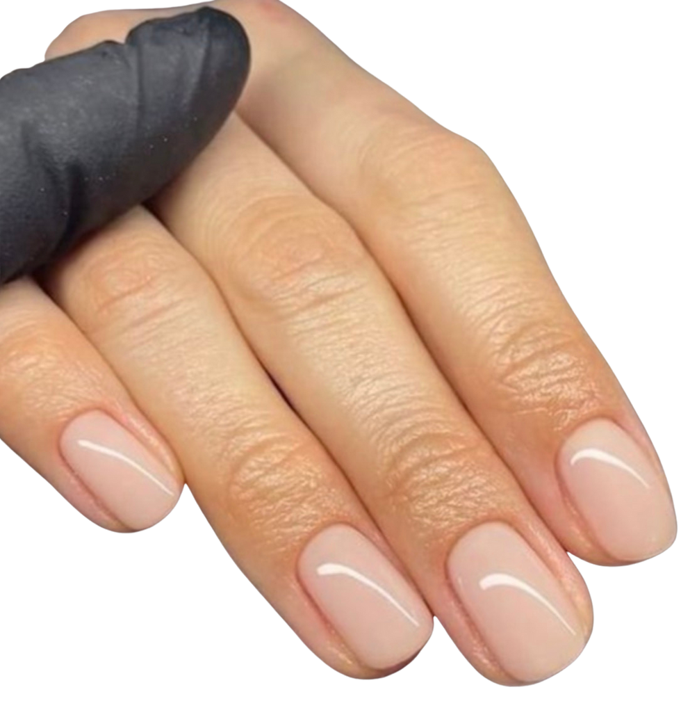 Close-up photo of perfectly manicured nails with a minimalist nude finish.