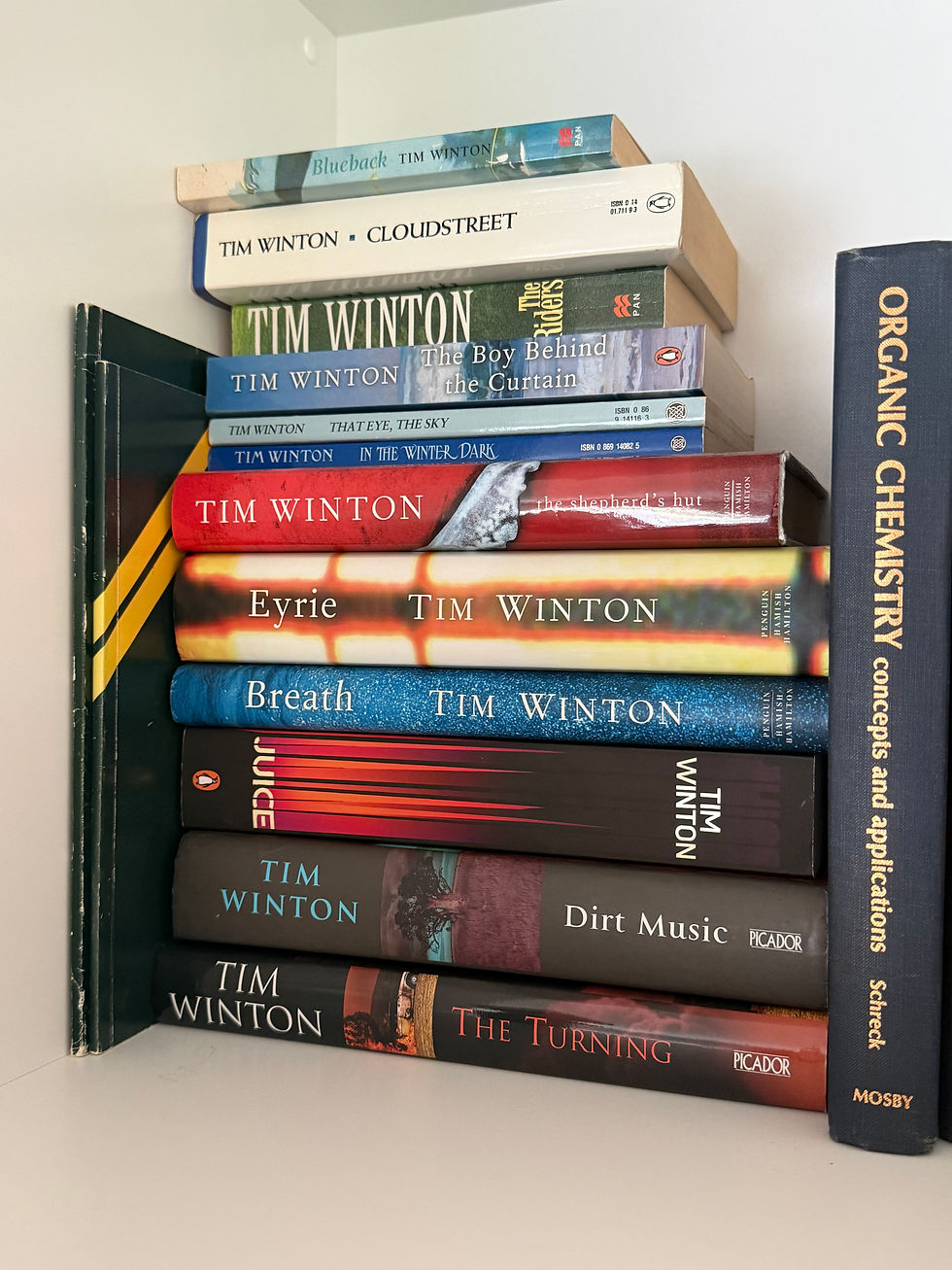 My bookshelf's little shrine to Tim Winton, sandwiched between chemistry texts and old school Yearbooks. (Source: Pete Mitchell)