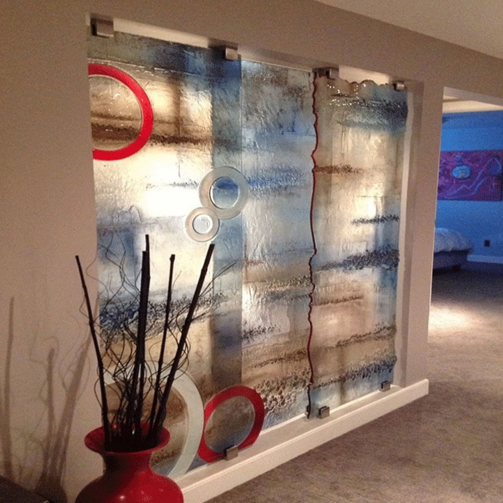 Modern Abstract (Oceans Deep) Textured Glass Decorative Wall: A contemporary kiln-formed glass art room divider or privacy screen, featuring hues of modern blues and browns. The design showcases a texture in the glass with geometric circles creating a sophisticated and modern aesthetic. Privacy Glass, Frosted Glass, Decorative Glass