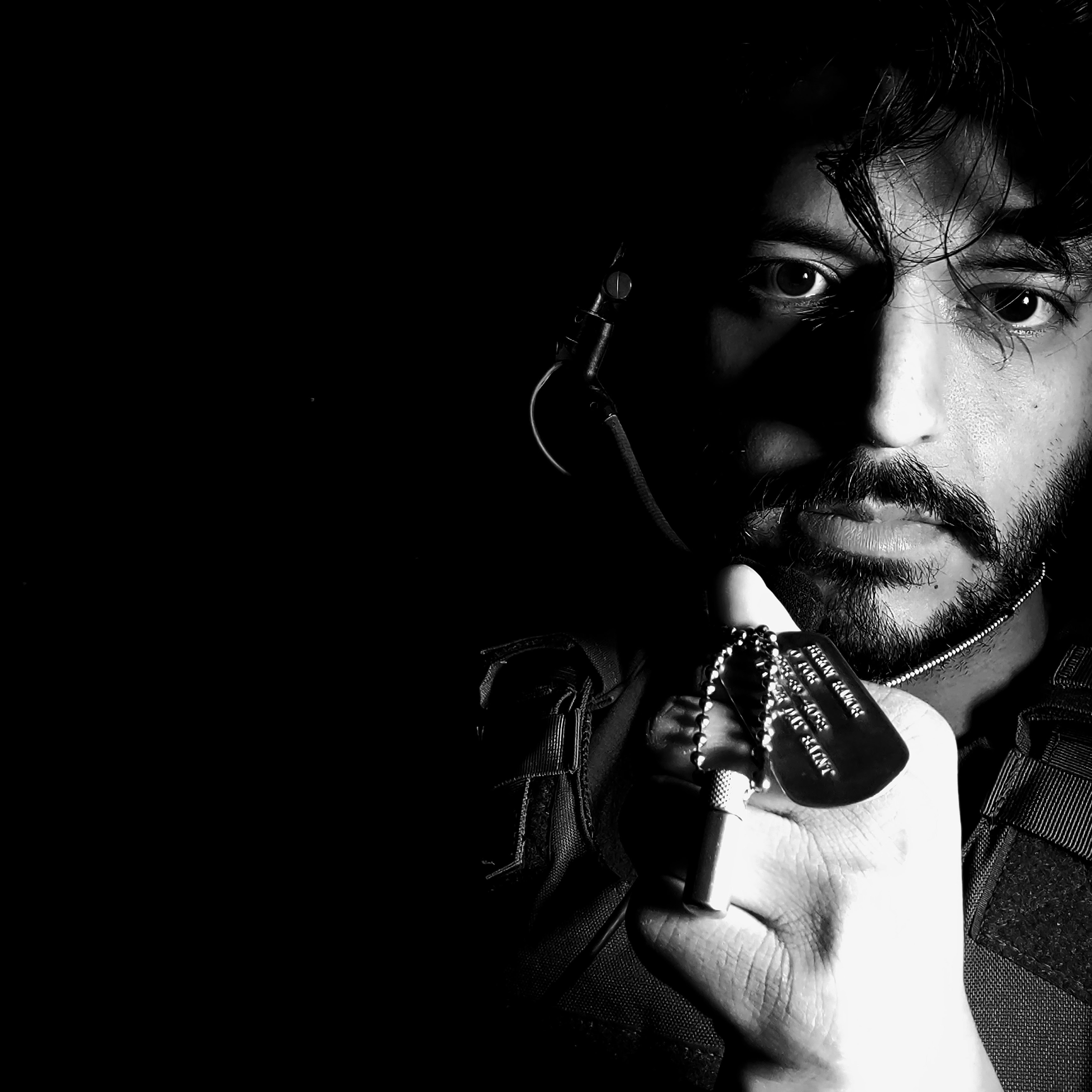 Self portrait of ex-Special Forces Utah fine artist sculptor Byron Ramos wearing his combat loadout to raise awareness of soldier suicide
