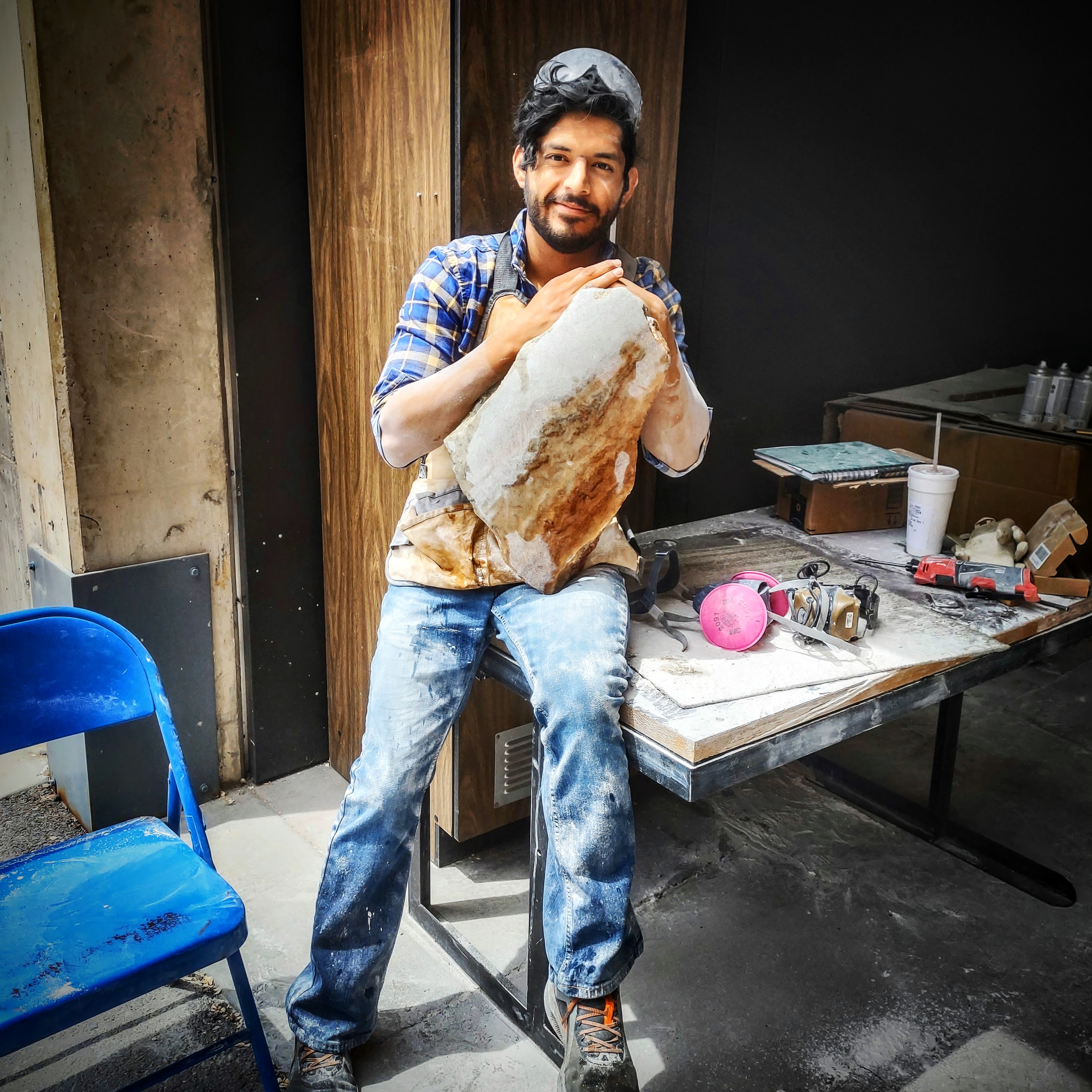 Utah fine artist sculptor Byron Ramos working on an alabaster sail