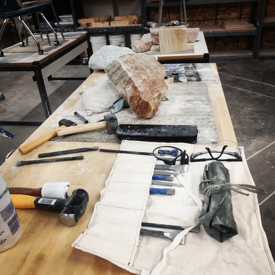 Utah fine artist sculptor Byron Ramos working on an alabaster sail