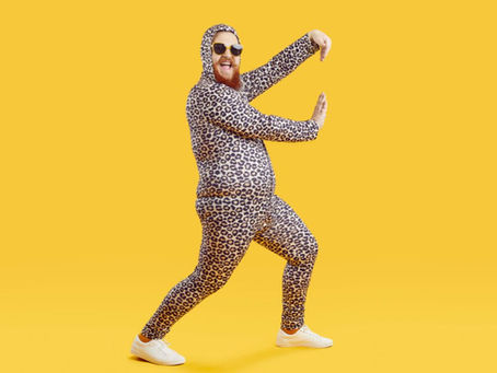 man dancing in leopard pajamas