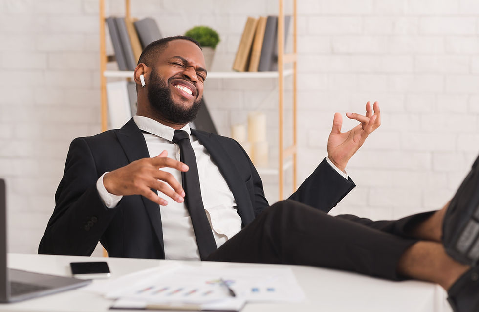 guy listening to music at desk