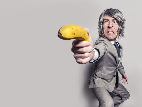 business man with banana gun