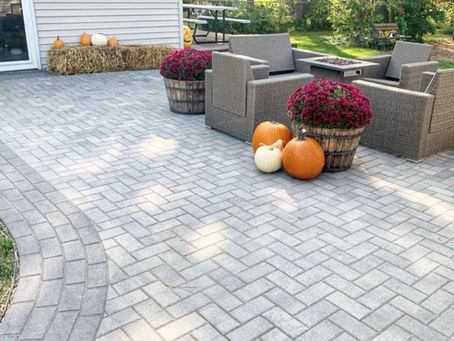 Paver patio installation in a Minnesota backyard showing professional hardscape design with clean layout and proper base preparation.